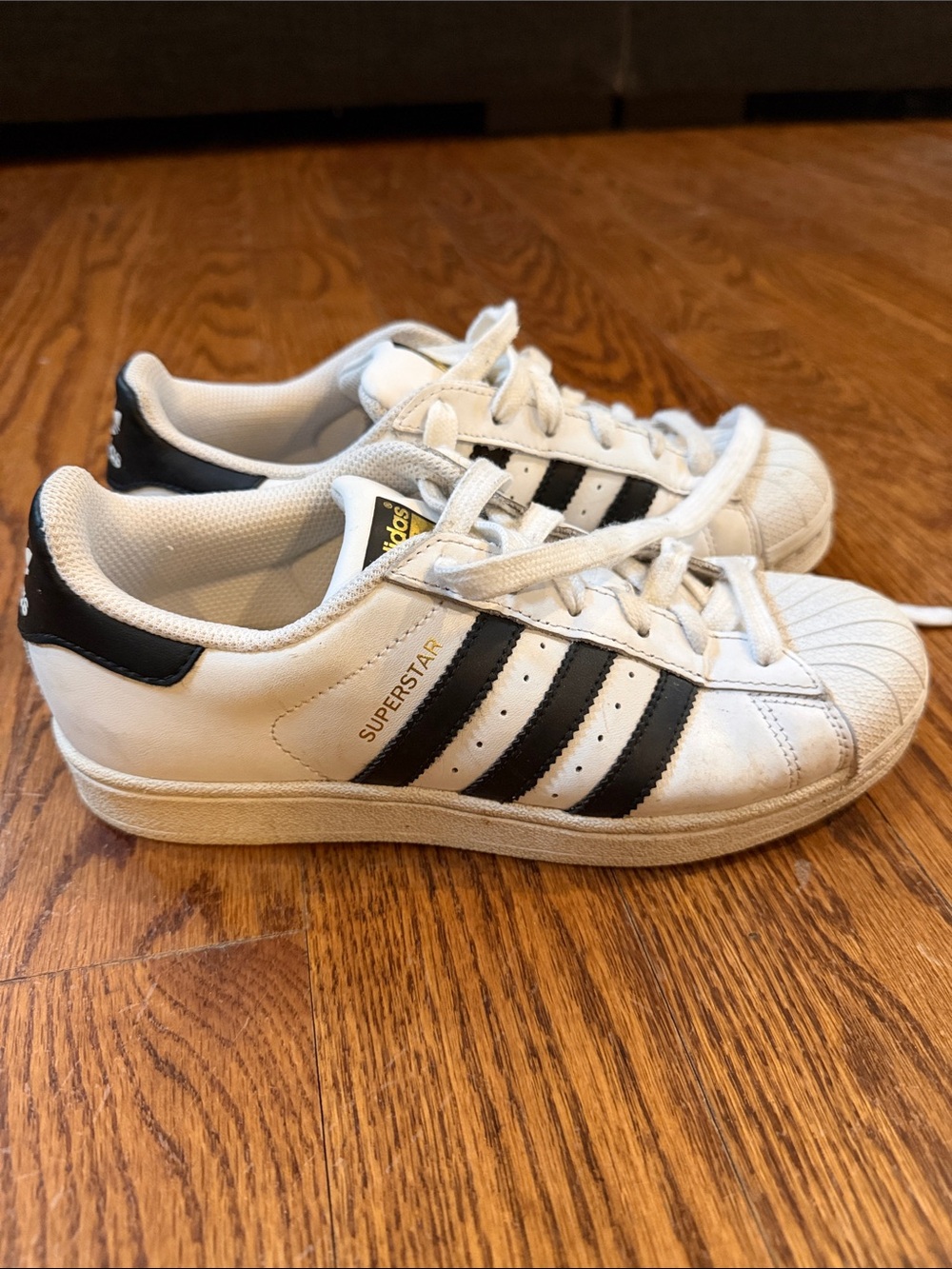 adidas women’s Superstar Sneakers in White and Black